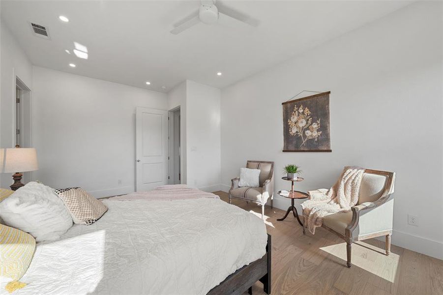 Bedroom featuring wood finished floors, recessed lighting, and ceiling fan Bedroom featuring wood finished floors, recessed lighting, and ceiling fan