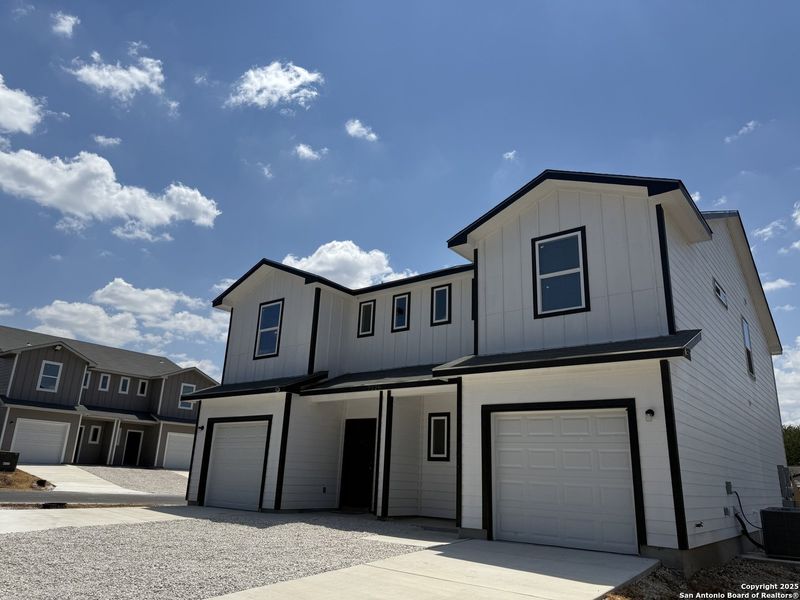 Front exterior of a new home in , San Antonio, TX, highlighting curb appeal (Image 2).