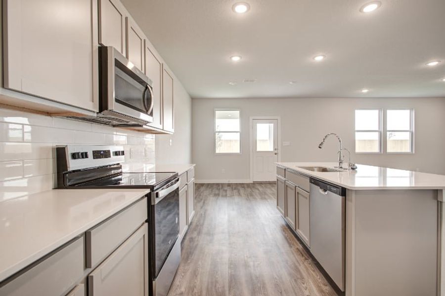 A kitchen with white cabinets. A kitchen with white cabinets.