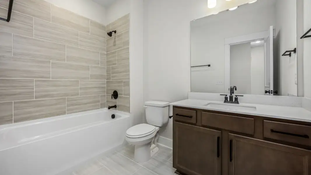Bathroom with shower and bathtub