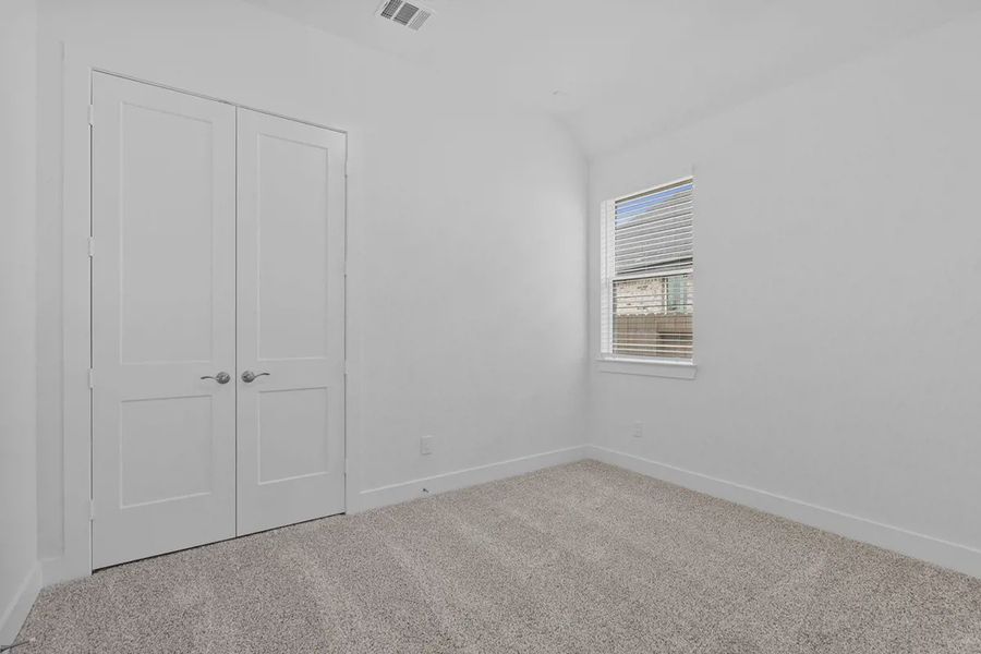 Representative unfurnished interior of a home built from the Brooks by Chesmar Homes in Grange, Katy (Image 29).