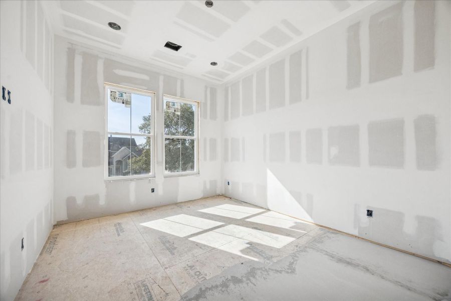 The secondary bedroom features a balanced layout with ample wall space and natural light from oversized windows. The secondary bedroom features a balanced layout with ample wall space and natural light from oversized windows.