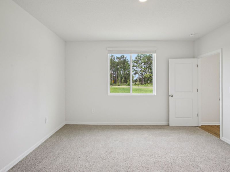 The Primary Bedroom of the Acadia at 7521 Mia Vine Dr.