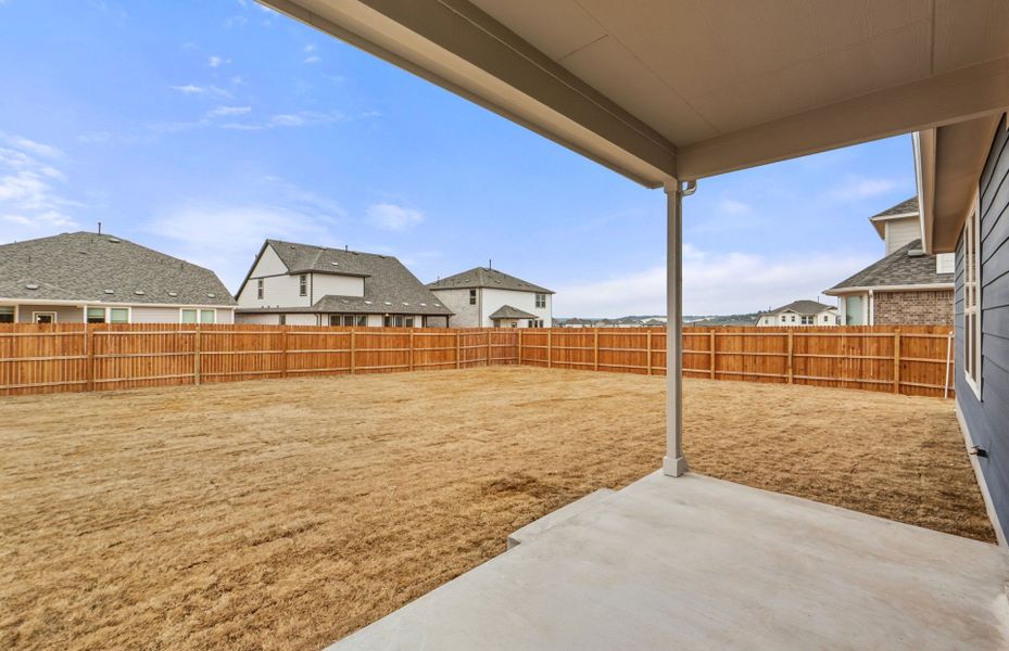Exterior details and patio area of a home in Saddleback at Santa Rita Ranch, Liberty Hill (Image 4). Exterior details and patio area of a home in Saddleback at Santa Rita Ranch, Liberty Hill (Image 4).