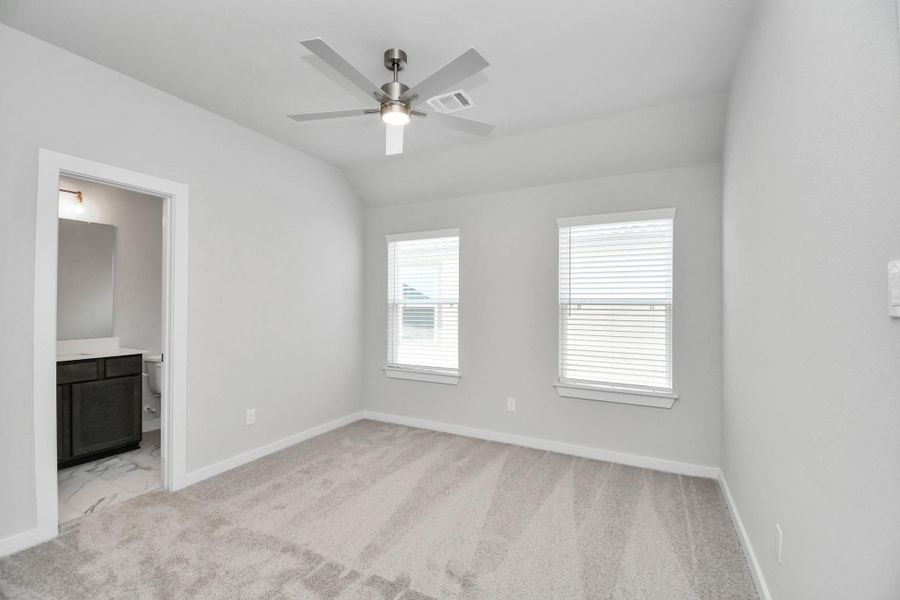 Secondary bedroom features plush carpeting, large windows that let in plenty of natural light, bright paint, and spacious closets. Secondary bedroom features plush carpeting, large windows that let in plenty of natural light, bright paint, and spacious closets.