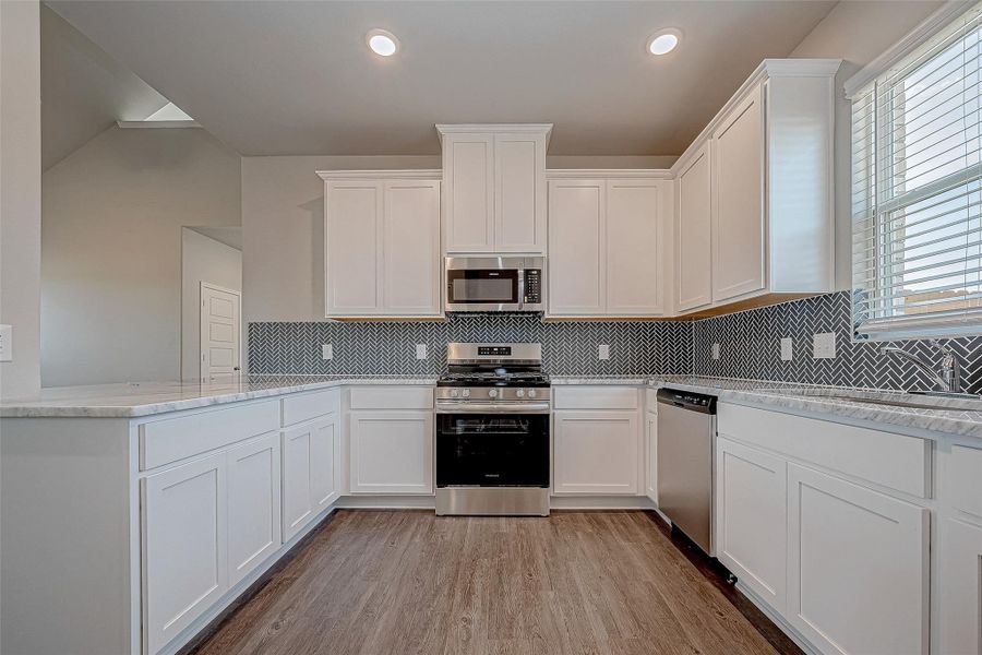 Furnished interior view inside a new home in Mill Creek Trails, Magnolia (Image 16).
