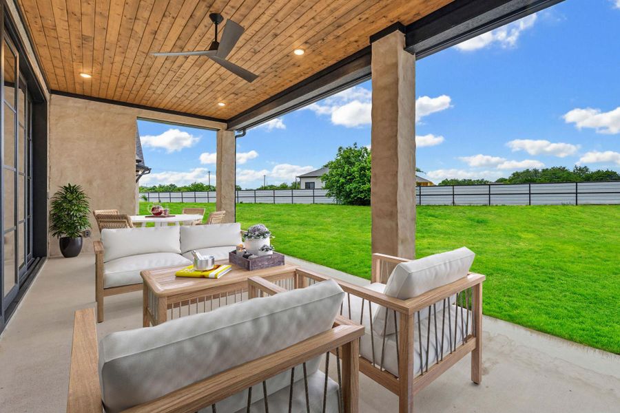 Expansive covered patio with a wood-finish ceiling, recessed lighting, and a ceiling fan