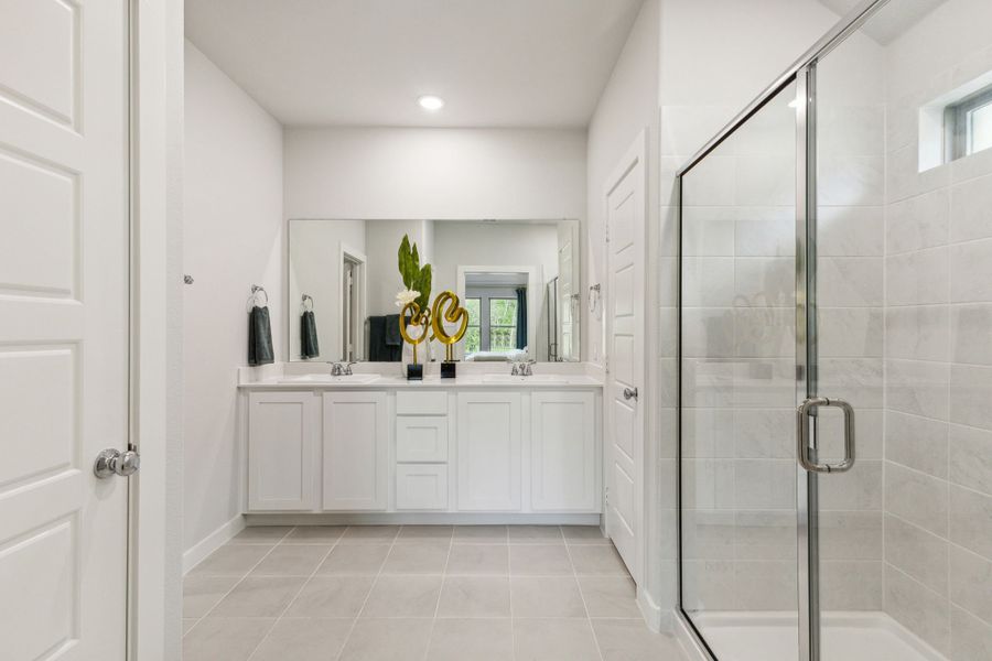 Primary Bathroom in the Emmy II home plan by Trophy Signature Homes - REPRESENTATIVE PHOTO