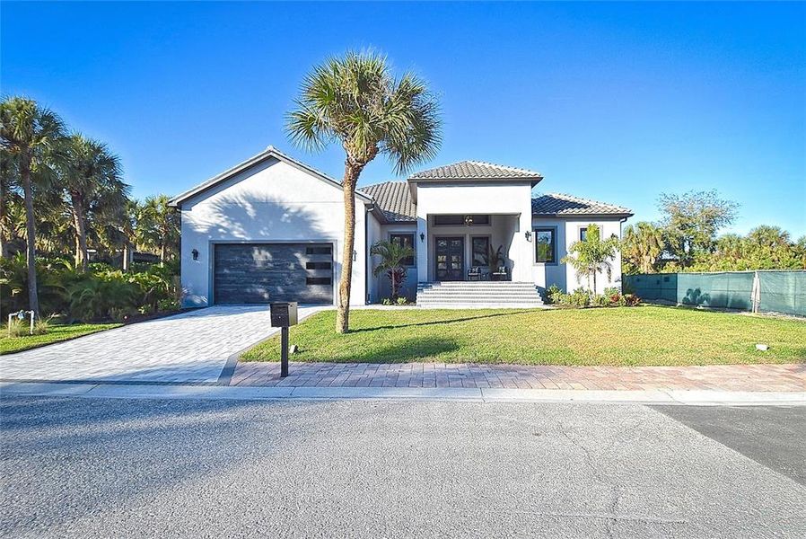 Front exterior of a new home in , Nokomis, FL, highlighting curb appeal (Image 33).