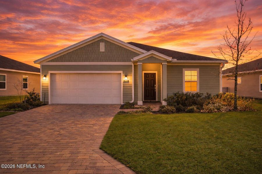 Front exterior of a new home in St Augustine Lakes, St. Augustine, FL, highlighting curb appeal (Image 25).