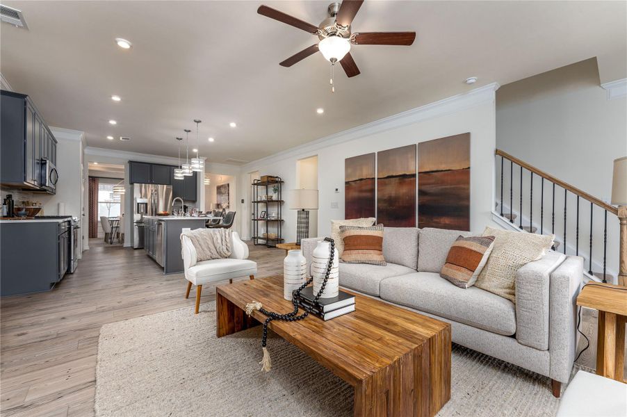 The Palmer- Family Room into the Kitchen. The sample image is a staged model, to be used for illustrative purposes only. Upgrades, options, and colors will vary. The Palmer- Family Room into the Kitchen. The sample image is a staged model, to be used for illustrative purposes only. Upgrades, options, and colors will vary.