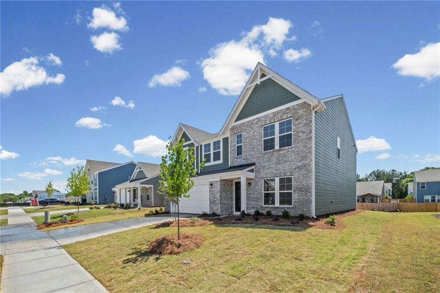 Front exterior of a new home in Cherry Glen, Euharlee, GA, highlighting curb appeal (Image 2). Front exterior of a new home in Cherry Glen, Euharlee, GA, highlighting curb appeal (Image 2).