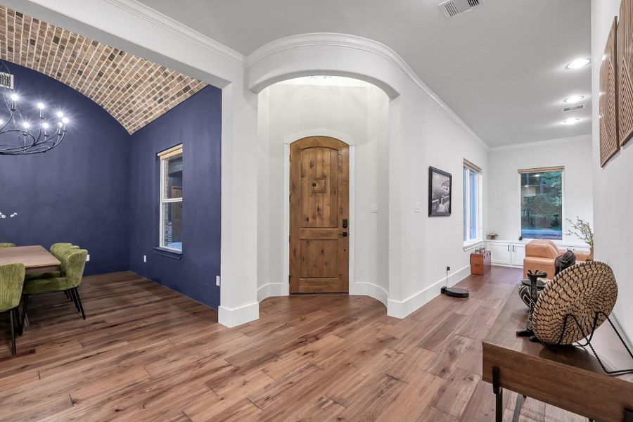 Entry is highlighted by the tower lighting, whether natural or from the chandelier.