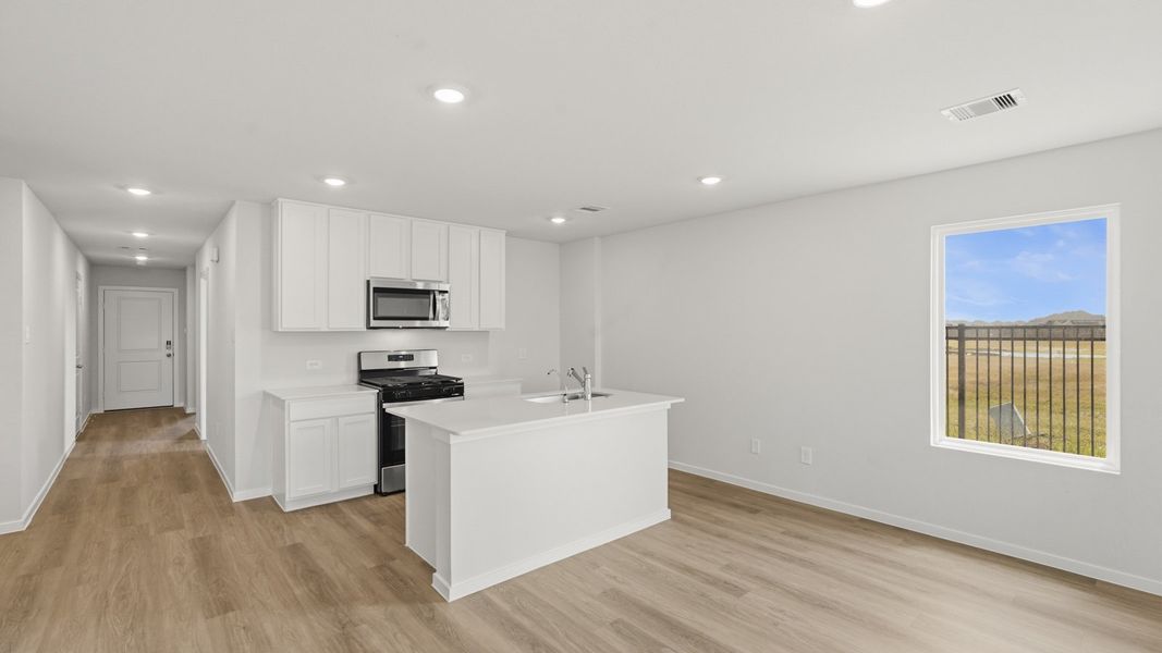 Furnished interior view inside a new home in Sunterra, Katy (Image 9).