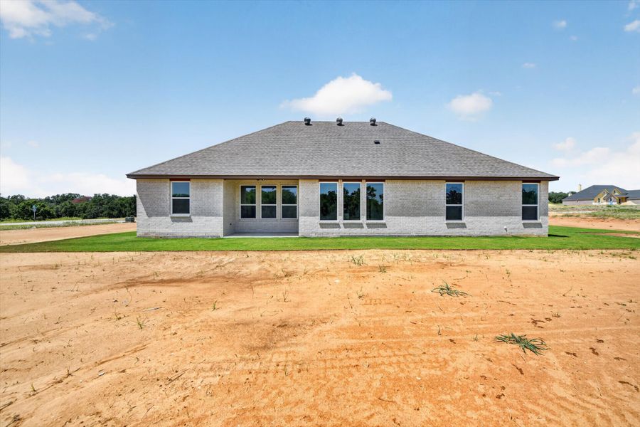 Front exterior of a new home in Taylor Ranch, Springtown, TX, highlighting curb appeal (Image 24).