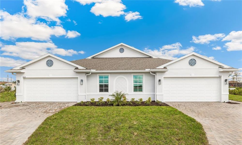 Front exterior of a new home in Sea Cove, Punta Gorda, FL, highlighting curb appeal (Image 16). Front exterior of a new home in Sea Cove, Punta Gorda, FL, highlighting curb appeal (Image 16).