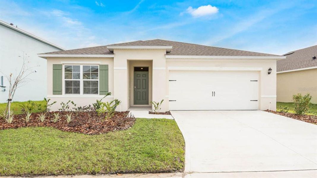 Front exterior of a new home in Lake Deer Estates, Poinciana, FL, highlighting curb appeal (Image 1). Front exterior of a new home in Lake Deer Estates, Poinciana, FL, highlighting curb appeal (Image 1).