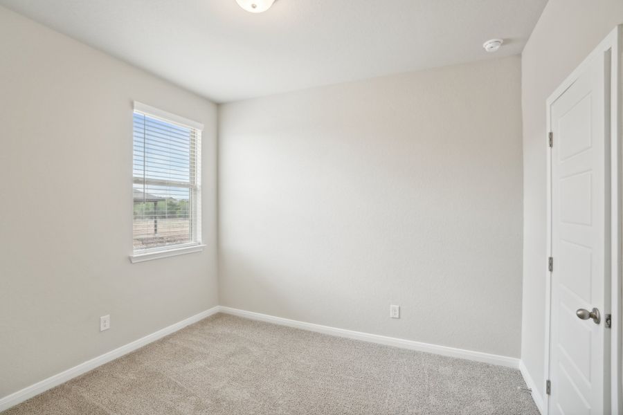 Guest bedroom in a Rio Grande floorplan at a Meritage Homes community. Guest bedroom in a Rio Grande floorplan at a Meritage Homes community.