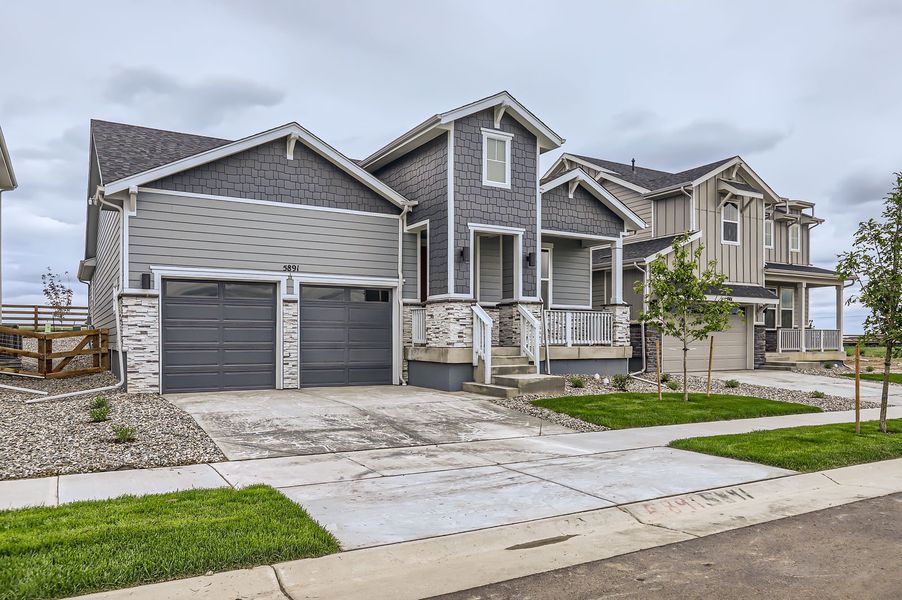 Front exterior of a new home in Barefoot Lakes, Longmont, CO, highlighting curb appeal (Image 22).