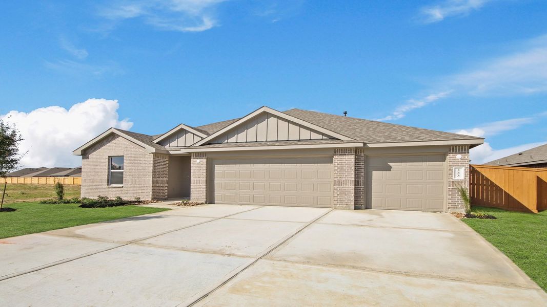 Front exterior of a new home in River Ranch Meadows, Dayton, TX, highlighting curb appeal (Image 2).