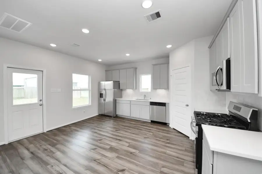 Furnished interior view inside a new home in Hill and Dale Ranch, Splendora (Image 3).
