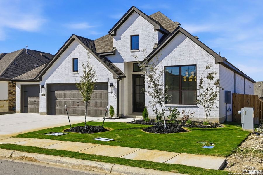 Front exterior of a new home in Ventana - 60', Bulverde, TX, highlighting curb appeal (Image 2).