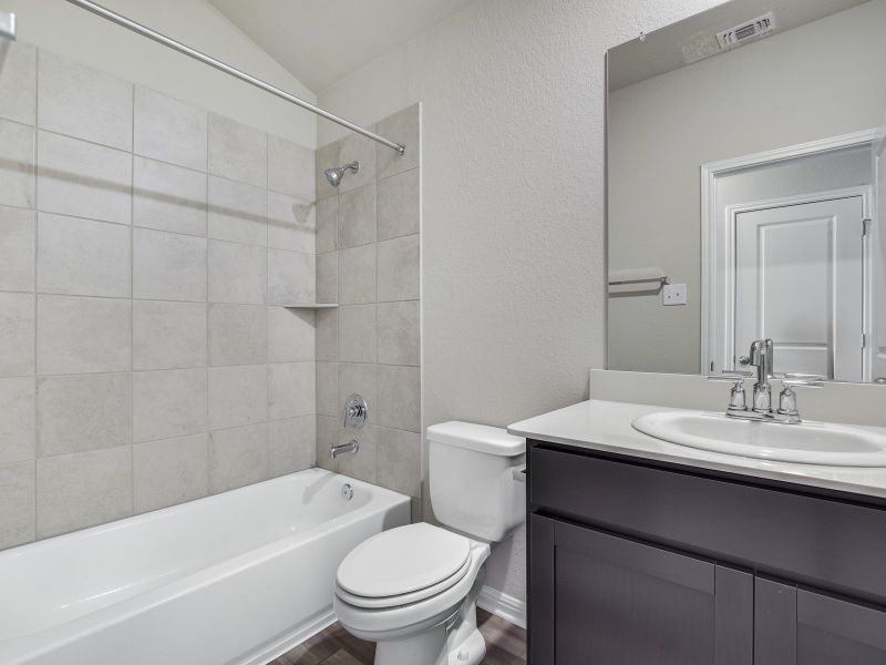 Furnished interior view inside a new home in Riverbend at Double Eagle - Reserve Collection, Cedar Creek (Image 4).