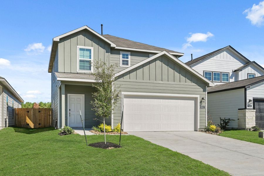 Front exterior of a new home in Northpark South, Porter, TX, highlighting curb appeal (Image 2). Front exterior of a new home in Northpark South, Porter, TX, highlighting curb appeal (Image 2).