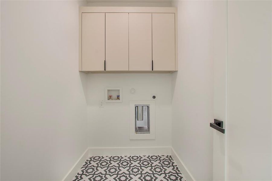 Washroom featuring cabinets, washer hookup, electric dryer hookup, tile patterned floors, and gas dryer hookup