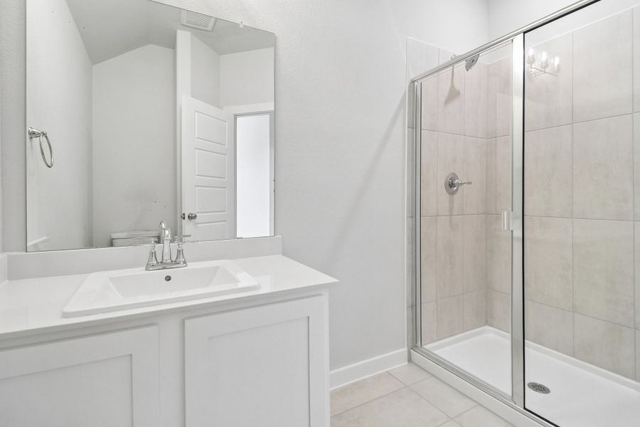 Secondary Bathroom in the Masters home plan by Trophy Signature Homes