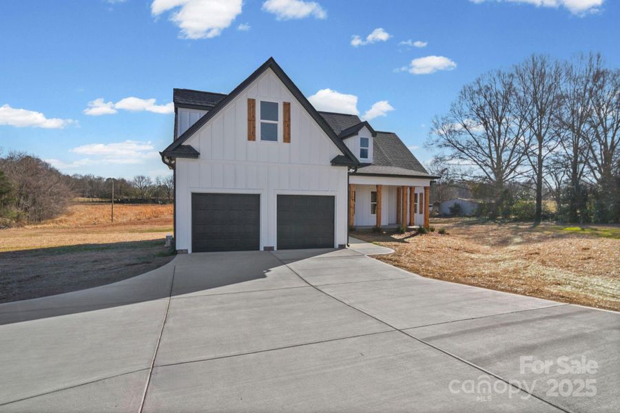 Front exterior of a new home in , Marshville, NC, highlighting curb appeal (Image 24).