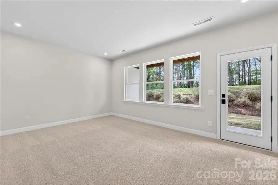 Light filled first floor flex space with access to the covered outdoor living