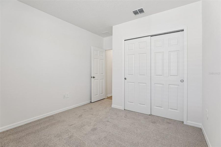 Spacious, unfurnished interior of a new home in Lake Deer Estates - Signature Series, Poinciana (Image 28).