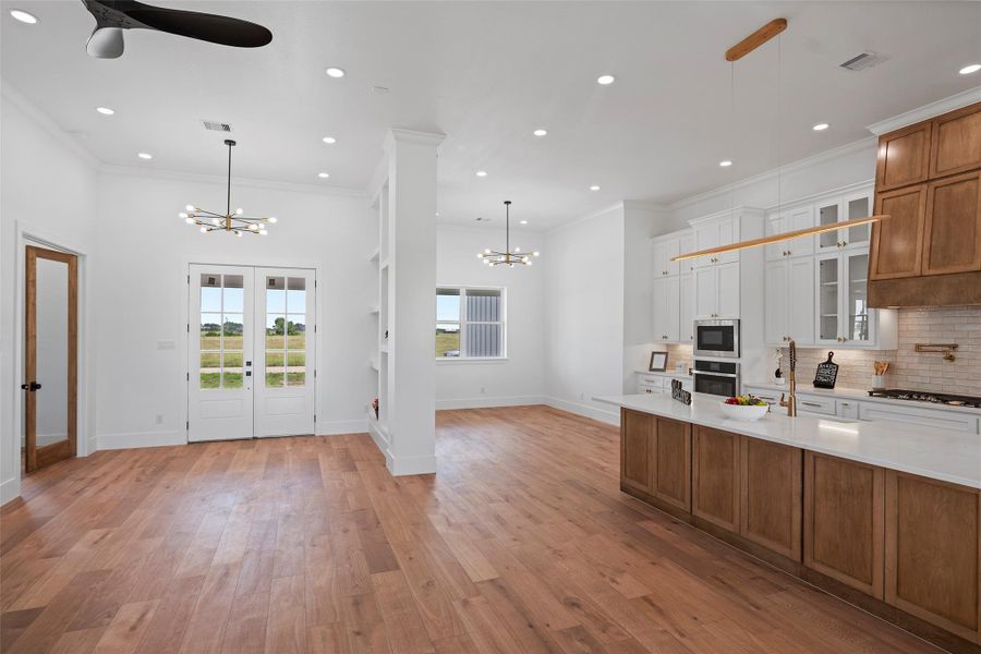 This bright and inviting office space features elegant French doors and beautiful LVP floors, perfect for productivity and inspiration.