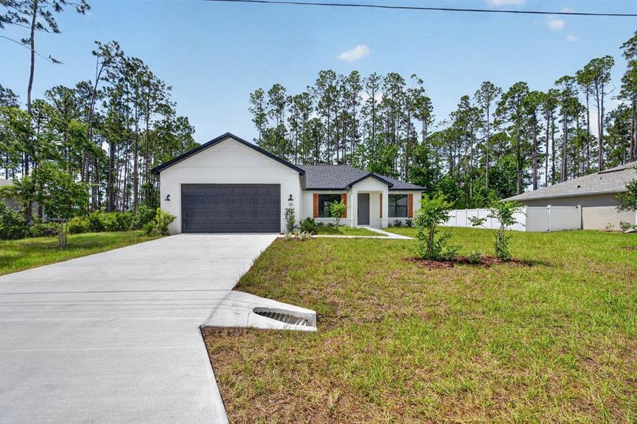Front exterior of a new home in , Palm Coast, FL, highlighting curb appeal (Image 20). Front exterior of a new home in , Palm Coast, FL, highlighting curb appeal (Image 20).