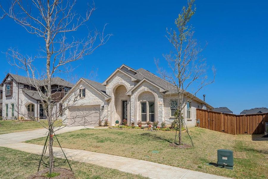 Front exterior of a new home in , Prosper, TX, highlighting curb appeal (Image 23). Front exterior of a new home in , Prosper, TX, highlighting curb appeal (Image 23).