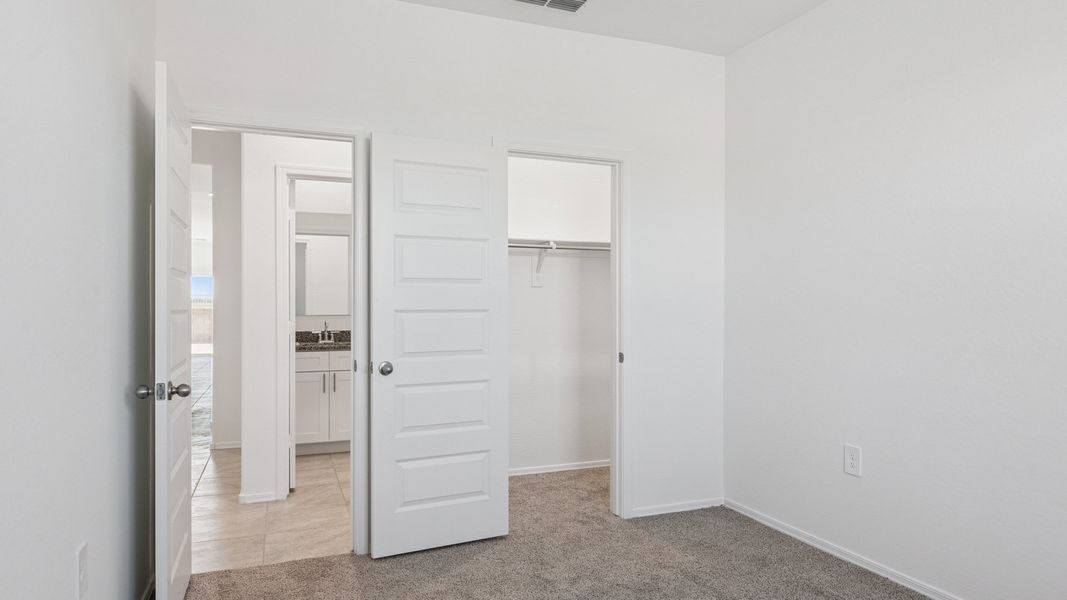 Representative unfurnished interior of a home built from the Ibis by D.R. Horton in Elena Trails, Maricopa (Image 25).