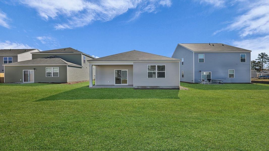 Exterior details and patio area of a home in Pine Hills at Cane Bay, Summerville (Image 3).