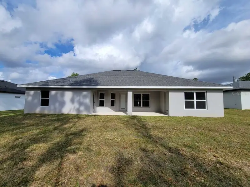 Exterior details and patio area of a home in Marion Oaks, Ocala (Image 3). Exterior details and patio area of a home in Marion Oaks, Ocala (Image 3).