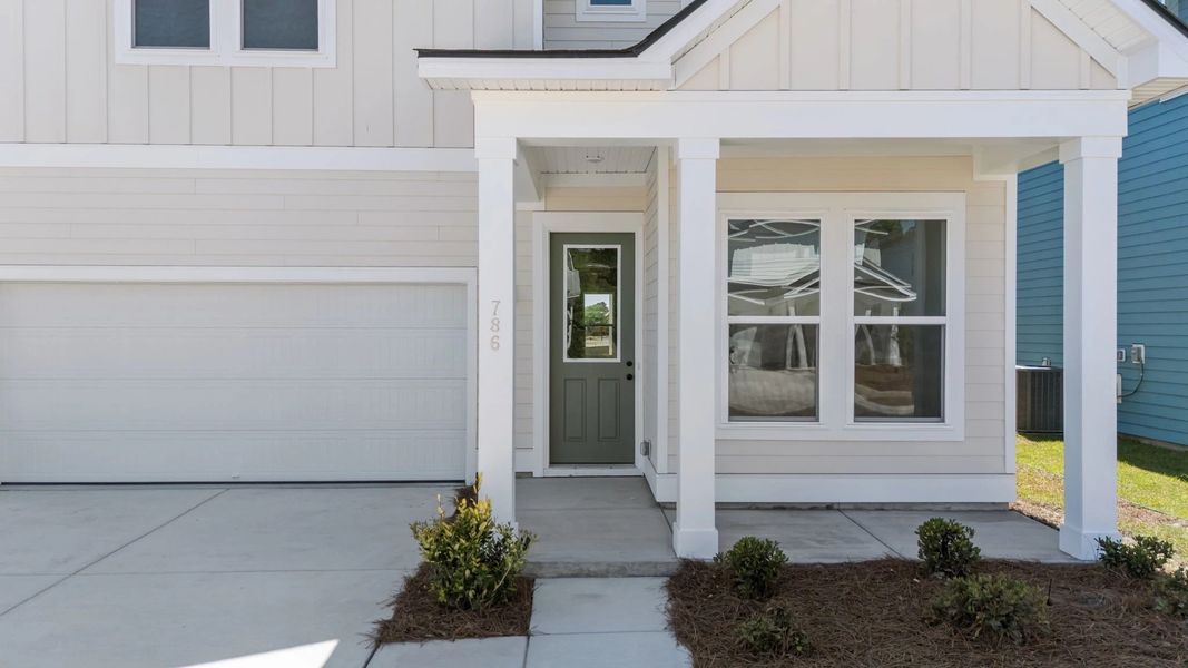 Exterior details and patio area of a home in Blue Heron Retreat, Little River (Image 3).