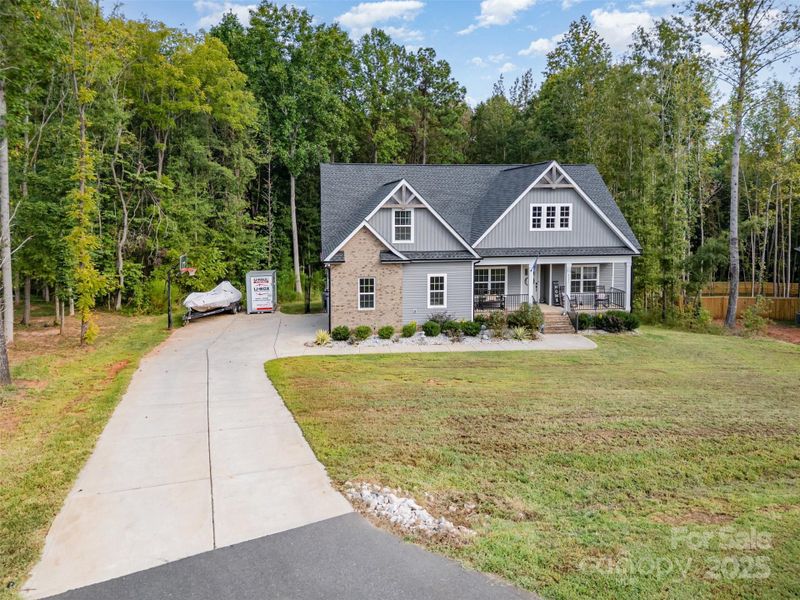 Front exterior of a new home in , Clover, SC, highlighting curb appeal (Image 21).