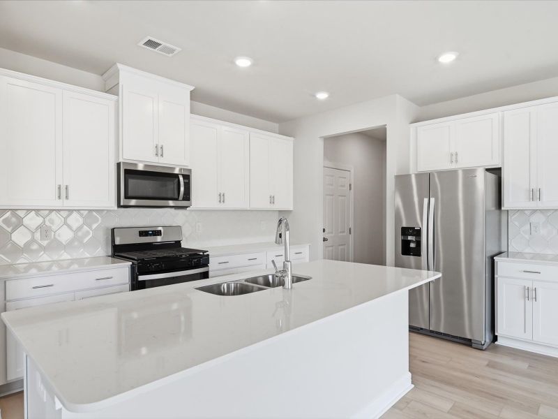 Furnished interior view inside a new home in The Farm at Wells Creek - Signature Collection, Gray Court (Image 4).
