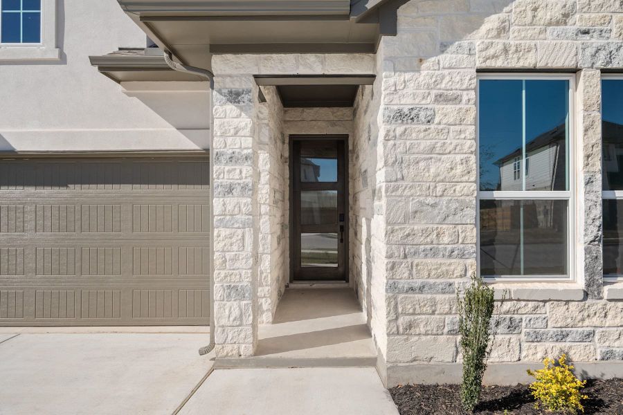 Exterior details and patio area of a home in Heritage, Dripping Springs (Image 3).