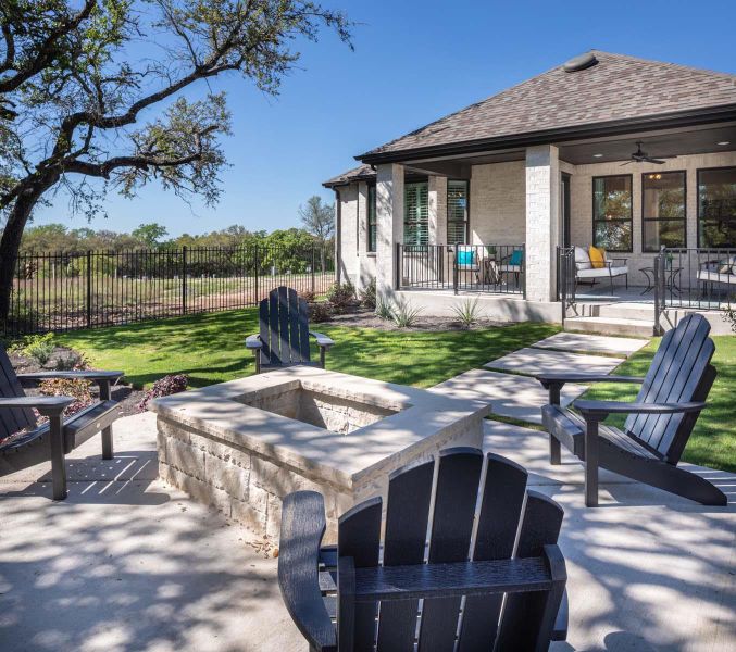 View of patio / terrace with a fire pit and fence