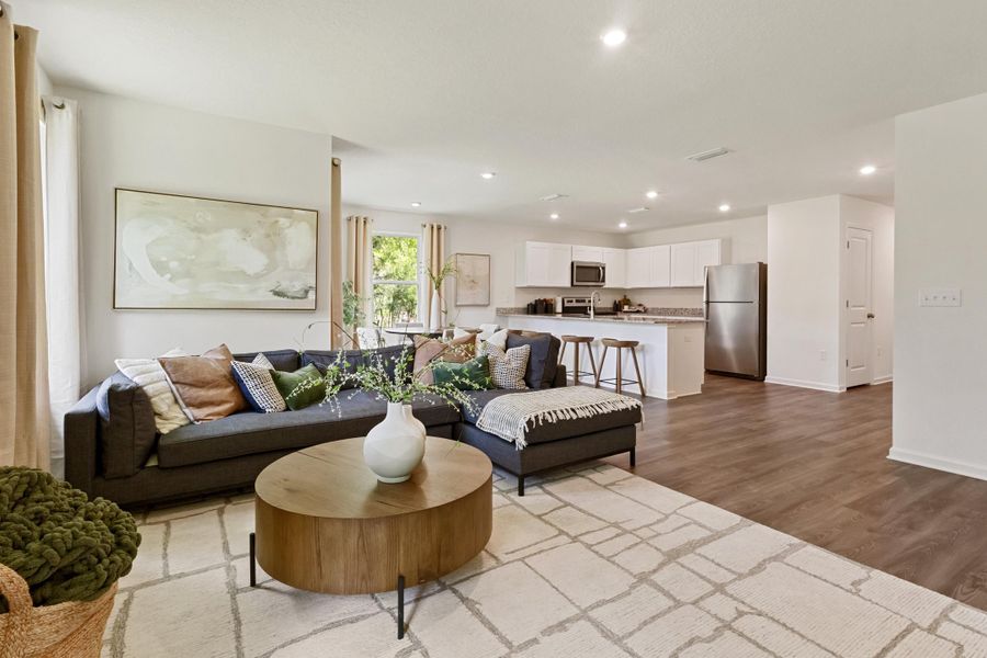 A living room with a couch and a table.