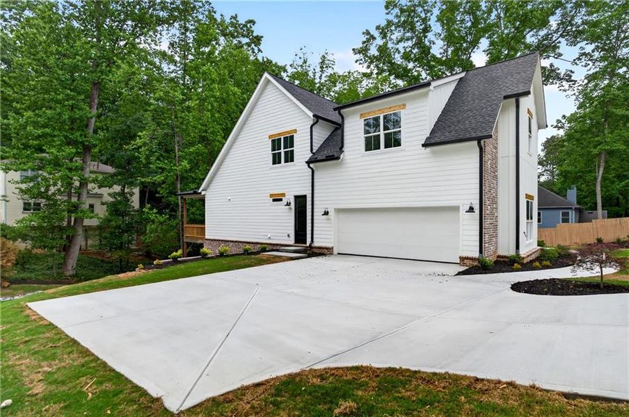 Front exterior of a new home in , Cumming, GA, highlighting curb appeal (Image 2).