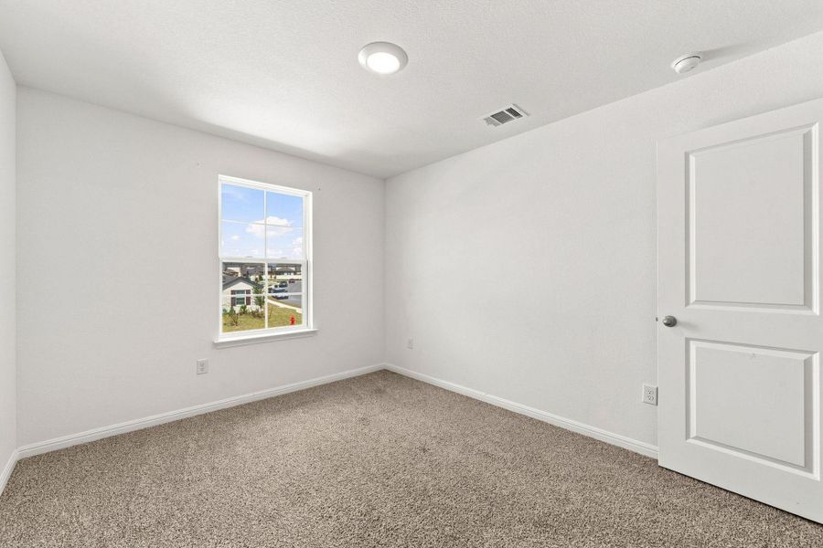 Soft carpeting pairs with a multi-pane window to create a quiet, comfortable space.