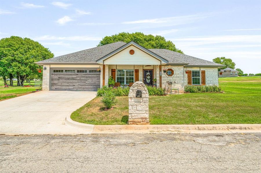 Front exterior of a new home in , Comanche, TX, highlighting curb appeal (Image 20).