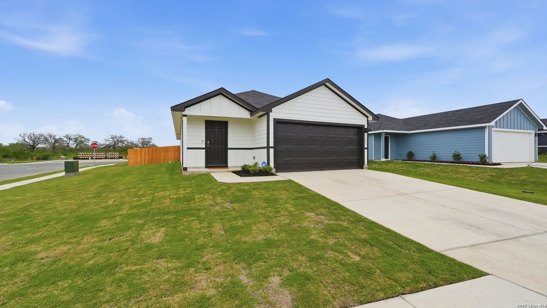 Front exterior of a new home in Ladera, Luling, TX, highlighting curb appeal (Image 24).