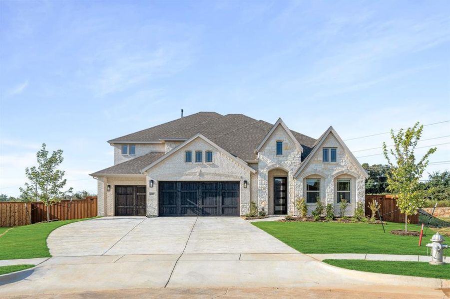 Front exterior of a new home in Rockwood 90, Mansfield, TX, highlighting curb appeal (Image 25). Front exterior of a new home in Rockwood 90, Mansfield, TX, highlighting curb appeal (Image 25).